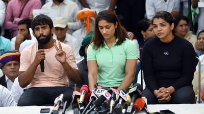 New Delhi, Apr 28 (ANI): Wrestlers Bajrang Punia, Vinesh Phogat and Sakshi Malik speak to the media during a protest against the Wrestling Federation of India (WFI) chief Brij Bhushan Singh, at Jantar Mantar in New Delhi on Friday. (ANI Photo/Rahul Singh) (Rahul Singh) New Delhi, Apr 28 (ANI): Wrestlers Bajrang Punia, Vinesh Phogat and Sakshi Malik speak to the media during a protest against the Wrestling Federation of India (WFI) chief Brij Bhushan Singh, at Jantar Mantar in New Delhi on Friday. (ANI Photo/Rahul Singh) (Rahul Singh)