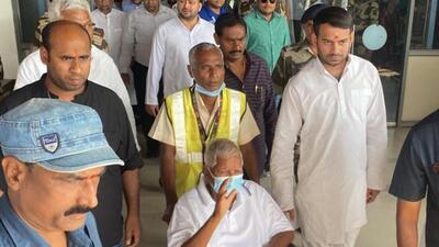 Clad in a white T-shirt and black trousers, Prasad was taken on a wheelchair out of the arrival gate at the airport. (HT photo | Santosh Kumar) Clad in a white T-shirt and black trousers, Prasad was taken on a wheelchair out of the arrival gate at the airport. (HT photo | Santosh Kumar)