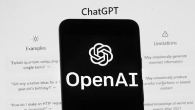The OpenAI logo is seen on a mobile phone in front of a computer screen which displays the ChatGPT home Screen. The draft bill is not final and lawyers say it will likely take years to come into force. (AP) The OpenAI logo is seen on a mobile phone in front of a computer screen which displays the ChatGPT home Screen. The draft bill is not final and lawyers say it will likely take years to come into force. (AP)