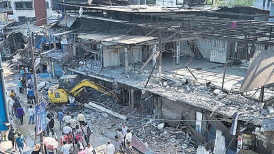 Mumbai, India - April 28, 2023: The Brihanmumbai Municipal Corporation (BMC) demolished the renowned 'MM Mithaiwala' and 'Delhi Sweets' sweet shops alongside Anand Road along with 19 other shops in order to widen the road, outside Malad Station (West), in Mumbai, India, on Friday, April 28, 2023. (Photo by Vijay Bate/HT Photo) (HT PHOTO) Mumbai, India - April 28, 2023: The Brihanmumbai Municipal Corporation (BMC) demolished the renowned 'MM Mithaiwala' and 'Delhi Sweets' sweet shops alongside Anand Road along with 19 other shops in order to widen the road, outside Malad Station (West), in Mumbai, India, on Friday, April 28, 2023. (Photo by Vijay Bate/HT Photo) (HT PHOTO)