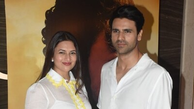 Actor Divyanka Tripathi and husband Vivek Dahiya were twinning in white at the screening of The Song of Scorpions. The film is directed by Anup Singh. (Varinder Chawla) 