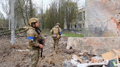 Russia-Ukraine war: A security officer looks at a damaged building, amid Russian invasion on Ukraine. (Reuters)