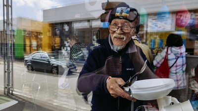 Fuminori Tsuchiko, 75-year-old humanitarian volunteer from Japan, looks through a window of his cafe, amid Russia's attack on Ukraine, in Kharkiv, Ukraine April 24. (REUTERS)
