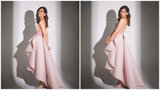 Manushi Chhillar dolled up for the event wearing a pink asymmetrical backless gown by Surya Sarkar.(Instagram/@manushi_chhillar)