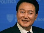 South Korea's President Yoon Suk Yeol​​ smiles while taking questions following an address at The Institute of Politics at the Harvard Kennedy School.
