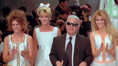 German designer Karl Lagerfeld joins models, from left, American Cindy Crawford, Canadian Linda Evangelista and Claudia Schiffer of Germany after the presentation of his 1996 spring-summer ready-to-wear fashion collection for Chanel in Paris on Oct. 19, 1995. Lagerfeld died in 2019 after dominating the fashion universe into his 80s. (AP) German designer Karl Lagerfeld joins models, from left, American Cindy Crawford, Canadian Linda Evangelista and Claudia Schiffer of Germany after the presentation of his 1996 spring-summer ready-to-wear fashion collection for Chanel in Paris on Oct. 19, 1995. Lagerfeld died in 2019 after dominating the fashion universe into his 80s. (AP)