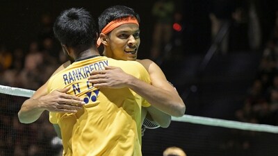 India's Satwiksairaj Rankireddy, front, and Chirag Shetty, back, celebrate winning against China's Xiang Yu Ren and Qiang Tan in the men's doubles final match of the Badminton Swiss Open at the St. Jakobshalle, in Basel, Switzerland, Sunday, March 26, 2023. (Georgios Kefalas/Keystone via AP) (AP)