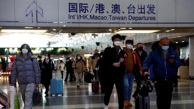 Travellers walk with their luggage at Beijing Capital International Airport, amid the coronavirus disease (COVID-19) outbreak in Beijing. (REUTERS) Travellers walk with their luggage at Beijing Capital International Airport, amid the coronavirus disease (COVID-19) outbreak in Beijing. (REUTERS)