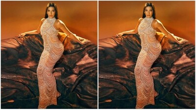 Nora Fatehi's stunning body-hugging embellished gown features a floor-length hem, sexy sheer neckline and a flattering body-con fit, which perfectly accentuated her curves. The intricate embellishments on the dress added a touch of glamour and sophistication to the overall look. (Instagram/@norafatehi ) Nora Fatehi's stunning body-hugging embellished gown features a floor-length hem, sexy sheer neckline and a flattering body-con fit, which perfectly accentuated her curves. The intricate embellishments on the dress added a touch of glamour and sophistication to the overall look. (Instagram/@norafatehi )
