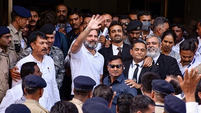 Congress leader Rahul Gandhi waves at supporters as he leaves from Surat District Court. (PTI) Congress leader Rahul Gandhi waves at supporters as he leaves from Surat District Court. (PTI)