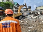 Rescue operation is underway as three persons were killed after a two-storey godown collapsed at Bhiwandi city, in Thane on Saturday. Rescue operation is underway as three persons were killed after a two-storey godown collapsed at Bhiwandi city, in Thane on Saturday.