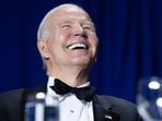 US President Joe Biden gestures during the White House Correspondents' Association dinner. US President Joe Biden gestures during the White House Correspondents' Association dinner.