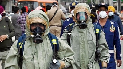 NDRF team officials wear protected suit and mask arrive for the rescue operation after a gas leak incident occur at a factory in Giaspura area of Ludhiana, (ANI) NDRF team officials wear protected suit and mask arrive for the rescue operation after a gas leak incident occur at a factory in Giaspura area of Ludhiana, (ANI)