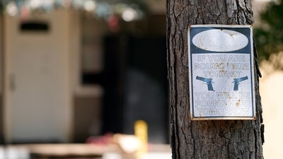 A warning sign is seen Sunday, April 30, 2023, outside the home where a mass shooting occurred Friday night, in Cleveland, Texas. (AP) A warning sign is seen Sunday, April 30, 2023, outside the home where a mass shooting occurred Friday night, in Cleveland, Texas. (AP)