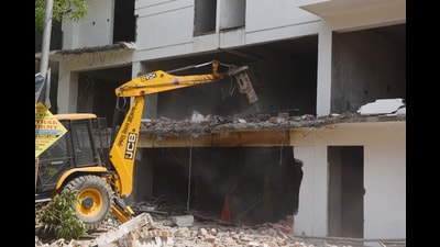 Demolition of an illegal construction site underway in Lucknow (HT File) Demolition of an illegal construction site underway in Lucknow (HT File)