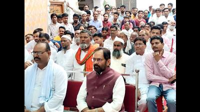 Former Union minister of minority affairs Mukhtar Abbas Naqvi listens to the 100th edition of Prime Minister Narendra Modi’s Mann ki Baat, at Kundarki, in Moradabad on Sunday. (ANI)