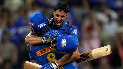 Mumbai Indian's Tilak Varma, facing towards camera celebrates along with Mumbai Indian's Tim David their team win against Rajasthan Royals (AP) Mumbai Indian's Tilak Varma, facing towards camera celebrates along with Mumbai Indian's Tim David their team win against Rajasthan Royals (AP)