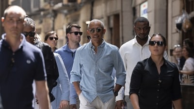 Former US President Barack Obama, centre takes a walk in the center of Barcelona, Spain. (AP) Former US President Barack Obama, centre takes a walk in the center of Barcelona, Spain. (AP)