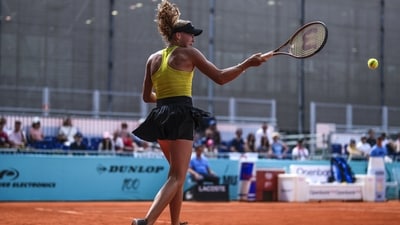 Mirra Andreeva of Russia returns the ball against Magda Linette of Poland during their match at the Madrid Open tennis tournament in Madrid, Spain, Saturday, April 29, 2023. (AP Photo/Manu Fernandez) (AP) Mirra Andreeva of Russia returns the ball against Magda Linette of Poland during their match at the Madrid Open tennis tournament in Madrid, Spain, Saturday, April 29, 2023. (AP Photo/Manu Fernandez) (AP)
