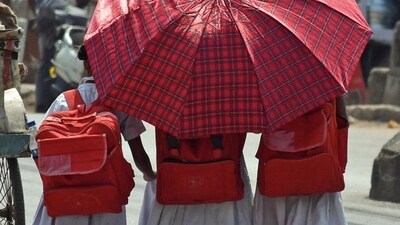 Students protect themselves from the scorching heat amid intense heatwave across India. (ANI Photo) Students protect themselves from the scorching heat amid intense heatwave across India. (ANI Photo)