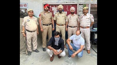 The arrested accused have been identified as Jaljodh Masih and Lucky, who were running an immigration office without a licence and were fraudulently collecting money from people for sending them abroad. (HT Photo) The arrested accused have been identified as Jaljodh Masih and Lucky, who were running an immigration office without a licence and were fraudulently collecting money from people for sending them abroad. (HT Photo)