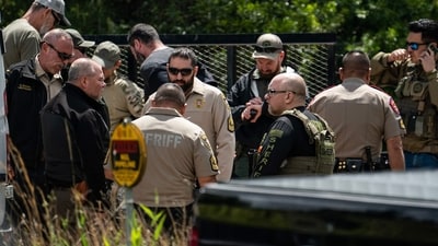 Texas US Shooting: Law enforcement search for the suspect a few miles from the scene where five people, including an 8-year-old child, were killed after a shooting inside a home. (AFP) Texas US Shooting: Law enforcement search for the suspect a few miles from the scene where five people, including an 8-year-old child, were killed after a shooting inside a home. (AFP)