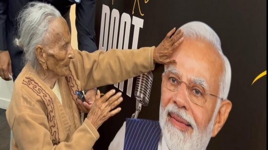 100-year-old Ramiben blessing PM Modi during the broadcast of 100th episode of 'Mann Ki Baat' in New Zealand's Auckland. (ANI)