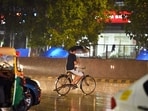 Commuters out during rain at Connaught Place, in New Delhi. (Sanjeev Verma/HT) (File) Commuters out during rain at Connaught Place, in New Delhi. (Sanjeev Verma/HT) (File)