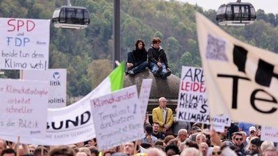 People attend a rally organised by the German Trade Union Confederation (DGB), an umbrella organisation representing around six million members from eight trade unions to mark Labour Day, in Koblenz, Germany. (Thilo Schmuelgen / Reuters) People attend a rally organised by the German Trade Union Confederation (DGB), an umbrella organisation representing around six million members from eight trade unions to mark Labour Day, in Koblenz, Germany. (Thilo Schmuelgen / Reuters)
