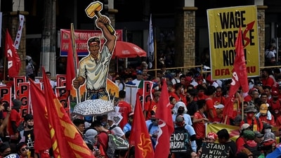 Demonstrators take part in a Labour Day rally in Mendiola, Manila. (Jam Sta Rosa / AFP) Demonstrators take part in a Labour Day rally in Mendiola, Manila. (Jam Sta Rosa / AFP)