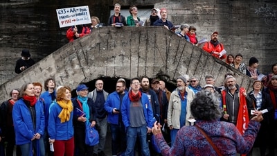 Demonstrators sing during the traditional May Day labour march, a day of mobilisation against the French pension reform law and for social justice, in Nantes, France. (Stephane Mahe / Reuters) Demonstrators sing during the traditional May Day labour march, a day of mobilisation against the French pension reform law and for social justice, in Nantes, France. (Stephane Mahe / Reuters)