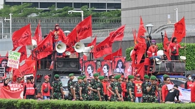 Demonstrators hold flags as they take part in a Labour Day rally in Jakarta. In Indonesia, rally-goers demanded the government repeal a job creation law they argue would benefit business at the expense of workers and the environment, reports AP. (Adek Berry / AFP) Demonstrators hold flags as they take part in a Labour Day rally in Jakarta. In Indonesia, rally-goers demanded the government repeal a job creation law they argue would benefit business at the expense of workers and the environment, reports AP. (Adek Berry / AFP)