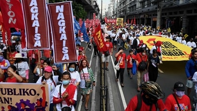 Demonstrators take part in a Labour Day rally in Mendiola, Manila. (Jam Sta Rosa / AFP) Demonstrators take part in a Labour Day rally in Mendiola, Manila. (Jam Sta Rosa / AFP)