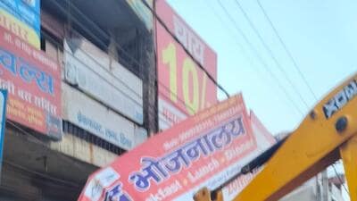 An illegal hoarding being razed in Gurugram on Monday. (HT Photo) An illegal hoarding being razed in Gurugram on Monday. (HT Photo)
