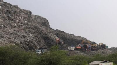 Over 40 foot high, the Bandhwari dump is one of the largest landfills in north India and it towers above the mesquite forests and surrounding Aravalli hills. (Parveen Kumar/ HT) Over 40 foot high, the Bandhwari dump is one of the largest landfills in north India and it towers above the mesquite forests and surrounding Aravalli hills. (Parveen Kumar/ HT)