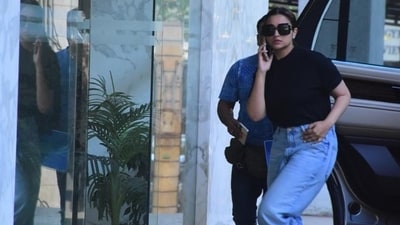 Parineeti Chopra was spotted in Bandra, Mumbai. For the outing, she wore a black T-shirt, blue denims, and white sneakers. She also opted for dark sunglasses. Parineeti Chopra was spotted in Bandra, Mumbai. For the outing, she wore a black T-shirt, blue denims, and white sneakers. She also opted for dark sunglasses.