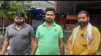 Shankar (centre) outside his eatery on Sua Road on Monday. (HT Photo ) Shankar (centre) outside his eatery on Sua Road on Monday. (HT Photo )