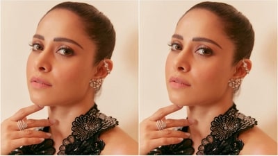 Completing her stylish ensemble, Nushrratt Bharuccha accessorized with a beautiful diamond ear cuff earring and stacked silver rings on her fingers. The understated yet elegant jewellery choices perfectly complemented her black gown. (Instagram/@nushrrattbharuccha) Completing her stylish ensemble, Nushrratt Bharuccha accessorized with a beautiful diamond ear cuff earring and stacked silver rings on her fingers. The understated yet elegant jewellery choices perfectly complemented her black gown. (Instagram/@nushrrattbharuccha)