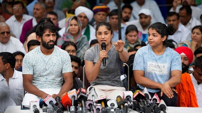 Wrestlers Bajrang Punia, Vinesh Phogat and Sakshi Malik speak with the media during their protest at Jantar Mantar, in New Delhi, Saturday, April 29, 2023. (PTI) Wrestlers Bajrang Punia, Vinesh Phogat and Sakshi Malik speak with the media during their protest at Jantar Mantar, in New Delhi, Saturday, April 29, 2023. (PTI)