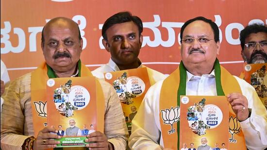 BJP president Jagat Prakash Nadda with Karnataka chief minister Basavaraj Bommai. (PTI)