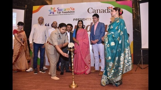 DCP (Central) Aparna Rajat Kaushik lightening the lamp to begin the sensitisation seminar on LGBTQIA+ issues. (HT Photo)