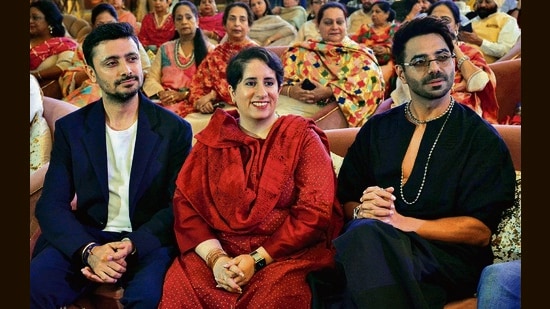Filmmaker Guneet Monga Kapoor (centre) and husband Sunny Kapoor with actor Aparshakti Khurana (right) at the event (Photos: Sant Arora/HT)