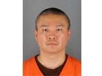 This photo shows Tou Thao, a former Minneapolis police officer who held back bystanders while his colleagues restrained a dying George Floyd. This photo shows Tou Thao, a former Minneapolis police officer who held back bystanders while his colleagues restrained a dying George Floyd.