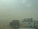 Illinois Dust Storm: A view of vehicles in a dust storm, which cut visibility to near zero and triggered a series of chain-reaction crashes involving dozens of vehicles.