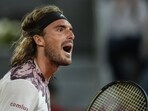 Greece's Stefanos Tsitsipas celebrates a point against Argentina's Sebastian Baez during their match at the Madrid Open tennis tournament in Madrid, Spain, Monday, May 1, 2023. (AP Photo/Manu Fernandez)