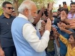 PM Modi with kids in Karnataka's Kalaburagi. PM Modi with kids in Karnataka's Kalaburagi.