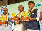 Congress President Mallikarjun Kharge with Karnataka Congress President DK Shivakumar and senior party leader Siddaramaiah releases the party's manifesto for the upcoming Karnataka Assembly elections, in Bengaluru.(PTI)