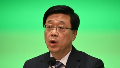 Hong Kong's Chief Executive John Lee announces an overhaul of district council elections during a press conference at the government headquarters in Hong Kong on May 2. (AFP) Hong Kong's Chief Executive John Lee announces an overhaul of district council elections during a press conference at the government headquarters in Hong Kong on May 2. (AFP)