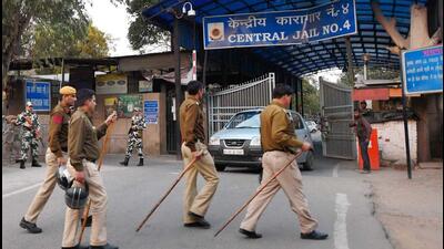 Security personnel stand guard outside at a gate of Tihar Jail. (PTI) Security personnel stand guard outside at a gate of Tihar Jail. (PTI)