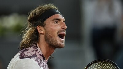 Greece's Stefanos Tsitsipas celebrates a point against Argentina's Sebastian Baez during their match at the Madrid Open tennis tournament in Madrid, Spain, Monday, May 1, 2023. (AP Photo/Manu Fernandez) (AP)